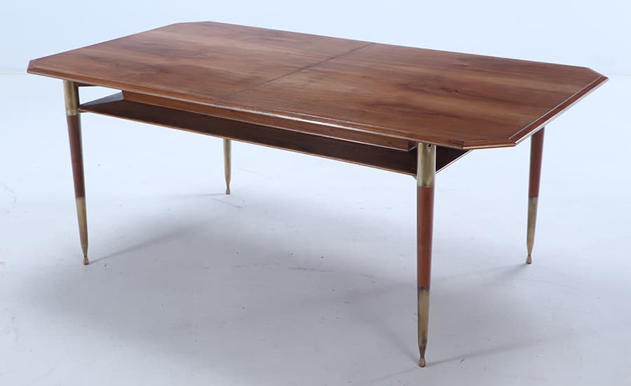 WALNUT DINING TABLE WITH BRASS MOUNTS AND ONE LEAF C 1960.: Walnut dining table with brass mounts and one leaf C 1960. Dimensions: 28.5" X 71" X 39.5" Leaf: 17.5"