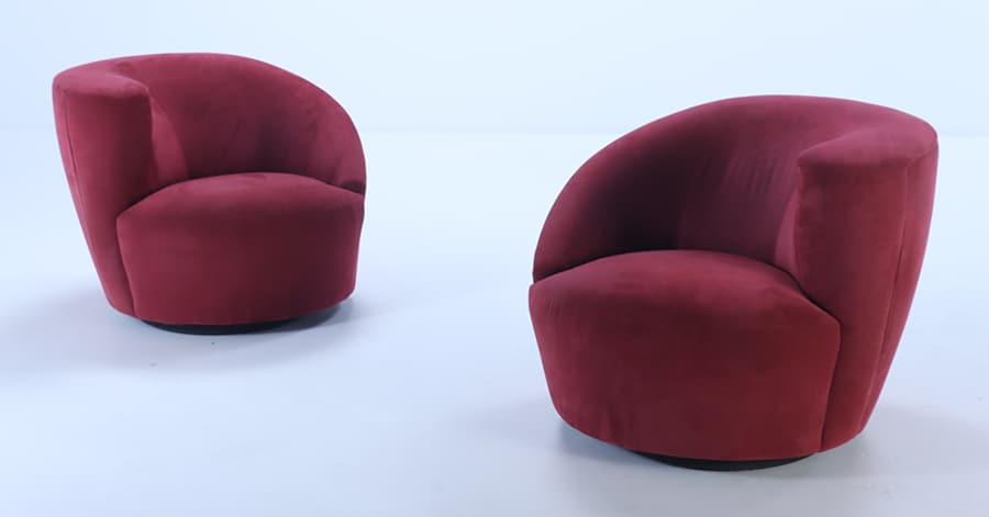 A PAIR OF KAGAN STYLE NAUTILUS CRANBERRY UPHOLSTERED SWIVEL LOUNGE CHAIRS.: A pair of Kagan style Nautilus cranberry upholstered swivel lounge chairs. Ht: 29" Wd: 36" Dpth: 35" Seat: 15"