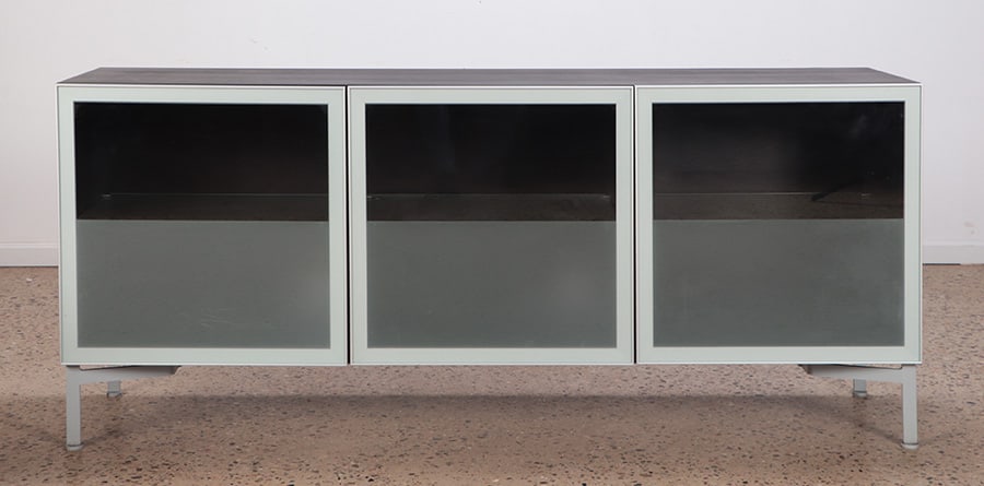 ITALIAN EBONIZED WOOD, ALUMINUM AND GLASS THREE: Italian ebonized wood, aluminum and glass three door sideboard. Ht: 33.25" Wd: 75.75" Dpth: 19"
