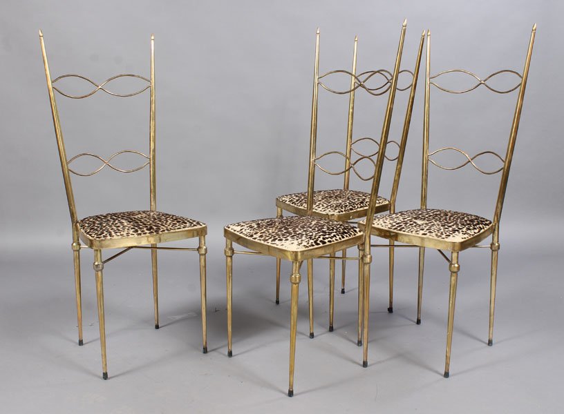 SET 4 GIO PONTI STYLE BRASS PLATED CHAIRS: A set of four Gio Ponti style brass plated dining chairs having stylized back splats over faux leopard seats circa 1960. Supported on tapered legs. Ht: 44" Width: 16" Depth: 14"
