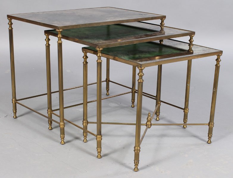 SET BRONZE 3 PC STACKING SIDE TABLES: A set of bronze three piece stacking side tables having distressed mirrored tops supported on reeded legs with x-form stretcher circa 1960. Ht: 18" Width: 21.5" Depth: 14.75"