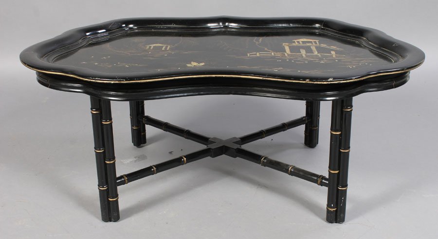 CHINOISERIE DECORATED SHAPED TRAY COFFEE TABLE: A chinoiserie decorated shaped tray coffee table supported on faux bamboo legs with cross stretcher. Ht: 18" Width: 44" Depth: 31"