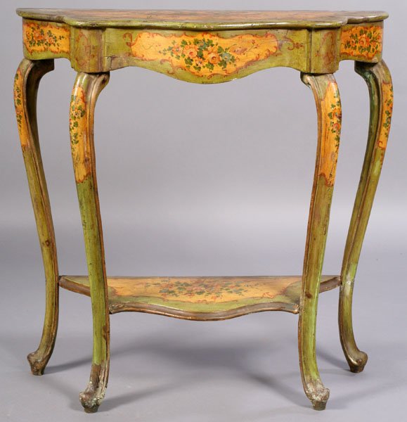 CONTINENTAL CARVED PAINTED DEMILUNE CONSOLE: A continental carved and painted demilune console table having a shaped top and apron supported on cabriole legs with lower shelf circa 1920. Ht: 37.5" Width: 35" Depth: 15"