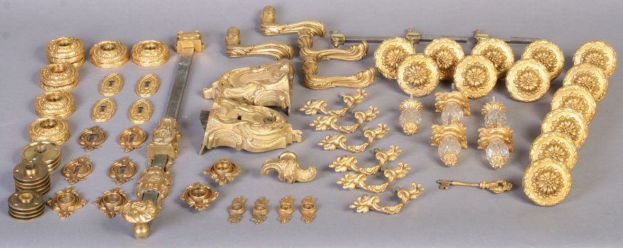 78 PC LOT ANTIQUE GOLD FINISHED HARDWARE C.1960: Seventy-eight piece lot of antique gold finished hardware originally purchased from P.E. Guerin in New York City. Including door knobs, closet spindles, door leavers with rosettes, keyplates and surfa