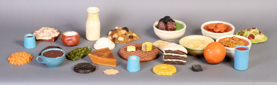 LARGE GROUP VINTAGE PLASTER DISPLAY FOOD: A large group of vintage plaster display food in a variety of forms and colors circa 1930.