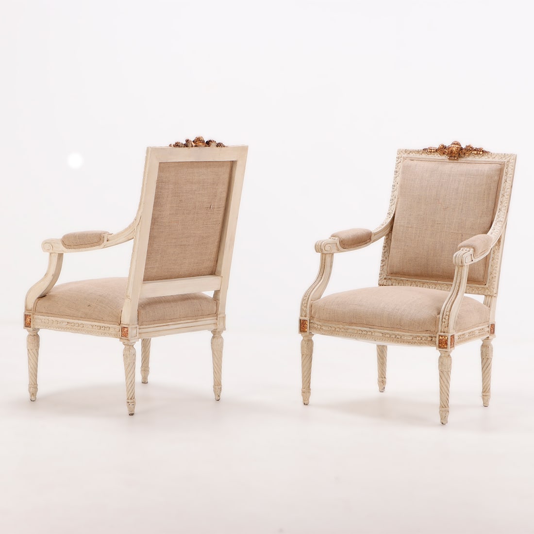 PAIR PAINTED AND GILTWOOD OPEN ARM CHAIRS WITH CARVED CREST RAIL C 1940 AND NEW FABRIC.: Pair painted and giltwood open arm chairs with carved crest rail C 1940 and new fabric. Ht: 43.25" Wd: 28" Dpth: 28.5" Seat: 19"