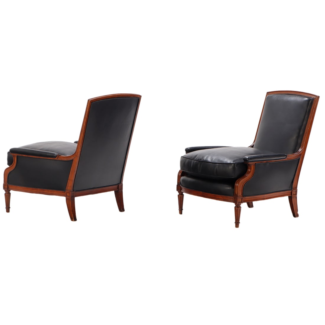 SLEEK PAIR OF LOUIS XVI STYLE LEATHER UPHOLSTERED BERGERE CHAIRS C 1950 IN THE MANNER OF JANSEN. (1 of 6)