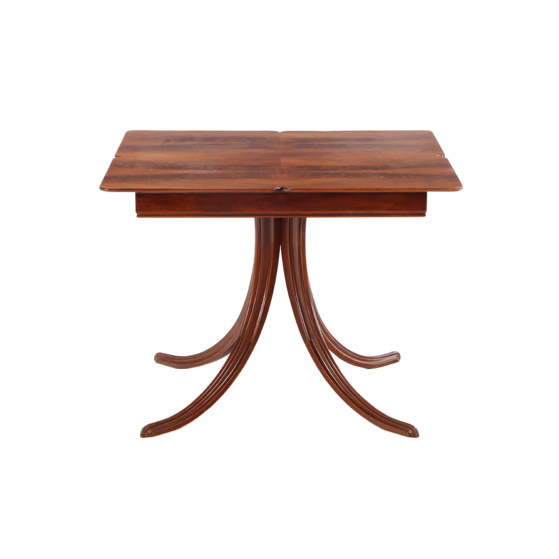 MAHOGANY SPLAY LEG GAMES TABLE WITH A CROTCH MAHOGANY SURFACE C 1940.: Mahogany splay leg games table with a crotch mahogany surface C 1940. Ht: 29.75" Wd: 39.25" Dpth: 39.25"