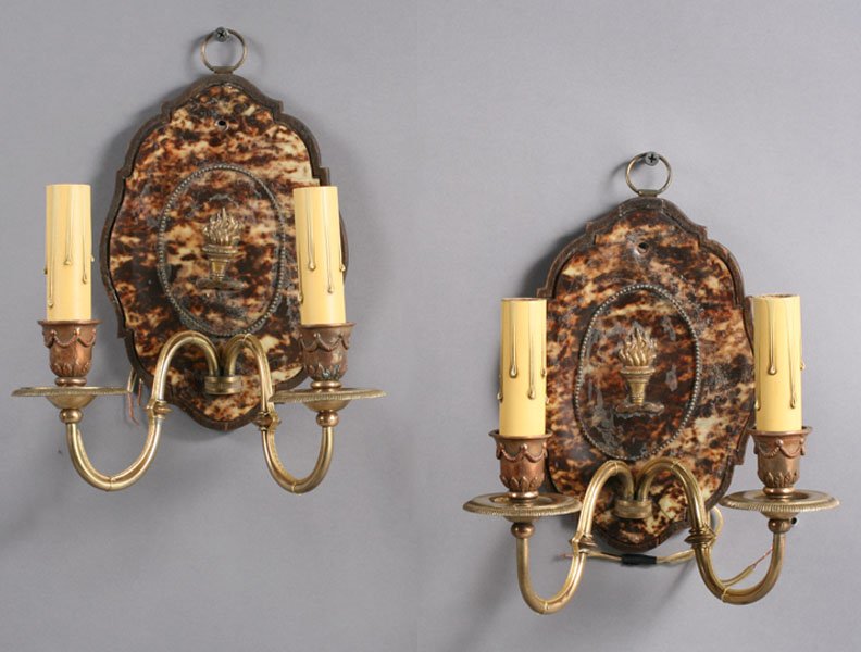PAIR TORTOISE SHELL BRONZE EMPIRE SCONCES: A pair of tortoise shell and bronze Empire style sconces, each having two arms and garland decorated candle cups circa 1900. Ht: 8" Width: 8"