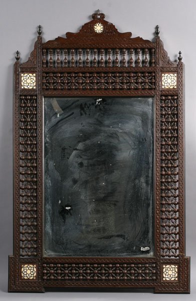 SYRIAN STICK & BALL CARVED INLAID MIRROR: A Syrian stick and ball carved and inlaid mirror having a shaped top and inlaid corners. Ht: 48" Width: 31.5"