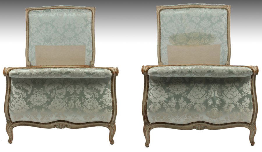 PAIR ANTIQUE FRENCH LOUIS XV STYLE DAYBEDS: Good pair of French Louis XV style carved and painted twin daybeds having shaped and upholstered ends and carved side rails circa 1900. Ht: 43" Width: 80" Depth: 39.5"
