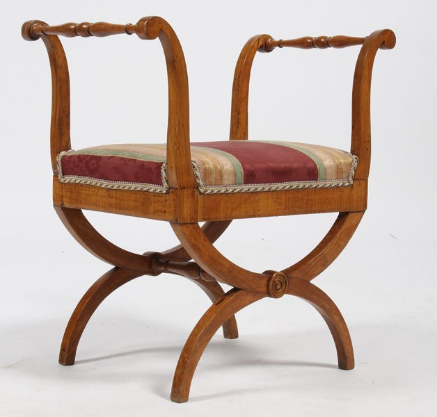 ANTQIUE BEIDERMEIER BENCH CURULE BASE C.1860: Antique Beidermeier bench having open and turned arm supports over upholstered seat and curule base circa 1860. Ht: 29" Width: 24.5" Depth: 15"