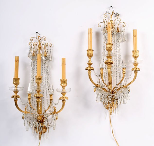 PR GILT BRONZE CRYSTAL 3 ARM SCONCES C.1920: Pair of gilt bronze three arm sconces having drop crystals and draped garland circa 1920. Ht: 23.5" Width: 13.5"
