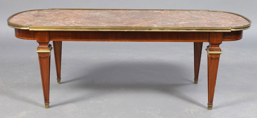 MARBLE TOP JANSEN COFFEE TABLE: Marble top Jansen coffee table having bronze mounted legs and an inset marble top circa 1950. Ht: 17" Width: 48" Depth: 20"