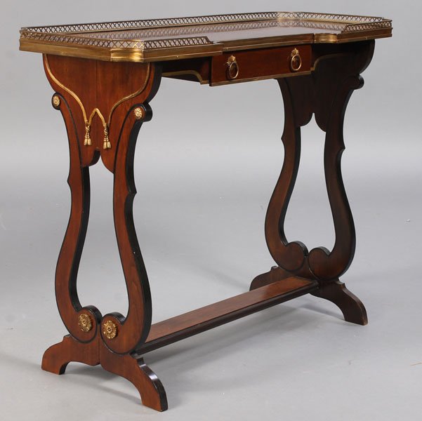 JANSEN SOFA TABLE: Jansen sofa table having a pierced brass gallery with bronze swag decorated sides circa 1940. Ht: 28.5" Width: 35.5" Depth: 13"