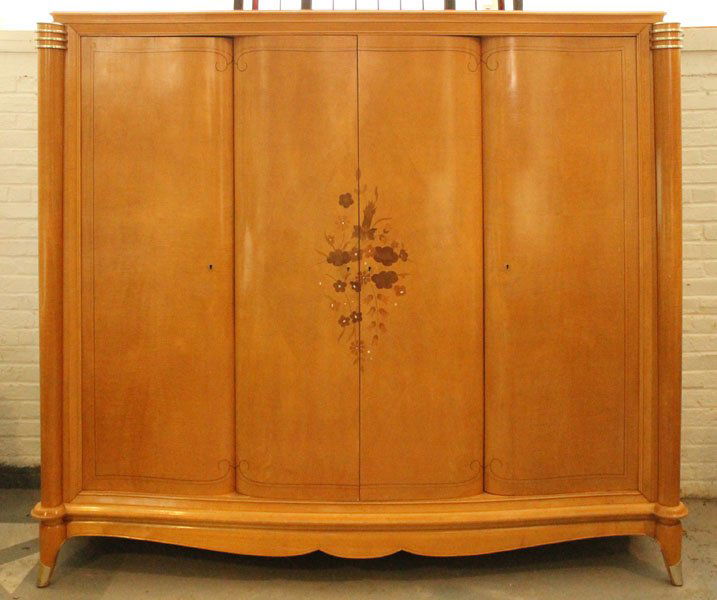 FRENCH ANDRE ARBUS ARMOIRE: A very good French Jules Leleu armoire circa 1940. Having a shaped cornice over two central bow front doors with subtle diamond inlay. Overlaid with satinwood, walnut, and mother of pear floral inlay,