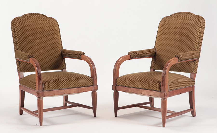 A PAIR OF FRENCH OPEN ARM CHAIRS IN THE MANNER OF: A pair of French open arm chairs in the manner of Andre Arbus C 1940. H 43.25"x W 27" x D 31.50" x SH 16.50"