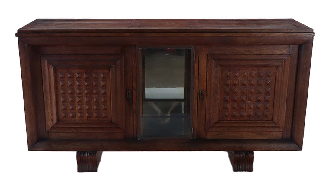 FRENCH OAK SIDEBOARD WITH CENTRAL GLASS DOOR IN THE MANNER OF CHARLES DUDOUYT C 1945.: French oak sideboard with central glass door in the manner of Charles Dudouyt C 1945. Ht: 40.25" Wd: 77.25" Dpth: 20"