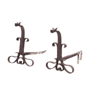 PAIR WROUGHT IRON ANDIRONS WITH DRAGON HEAD DECORATION IN THE MANNER OF SAMUEL YELLIN.: Pair wrought iron andirons with dragon head decoration in the manner of Samuel Yellin. Ht: 17" Wd: 12" Dpth: 25"