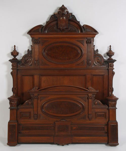 THE BEST HEAVY VICTORIAN WALNUT BERKEY GAY BED: Heavy Victorian walnut and burl walnut Renaissance Revival bed circa 1875, probably Berkey and Gay. The 5" thick highly decorated footboard having an oval burl panel. The headboard also with an oval p