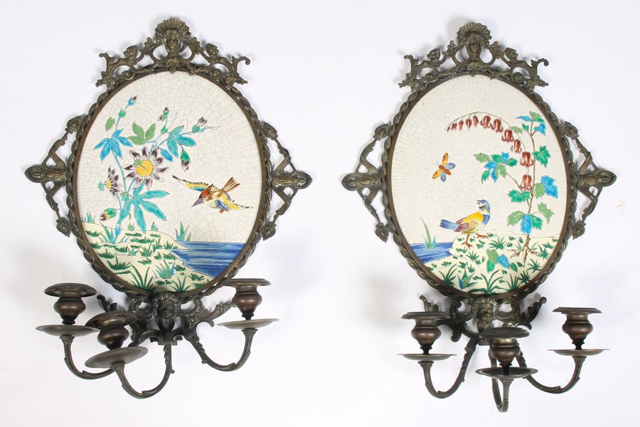 EASTLAKE PORCELAIN BRONZE SCONCES LONGWY: A pair of Eastlake style Longwy porcelain and bronze sconces having floral, and bird decorated back plates supporting three arms circa 1900. Dimensions: Ht: 18" Width: 14"