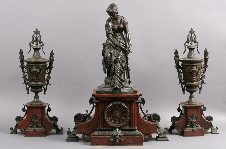 3 pc 19TH C. FRENCH BRONZE MARBLE CLOCK SET: A magnificent French nineteenth century bronze and red marble three piece garniture clock set exemplifying the finest workmanship of its era. With exquisitely detailed figure of Diana the Huntress ato