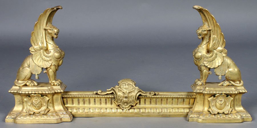PR ANTIQUE GRIFFIN FORM BRONZE CHENETS ANDIRONS: Pair of griffin form bronze chenets circa 1900. Ht: 18"