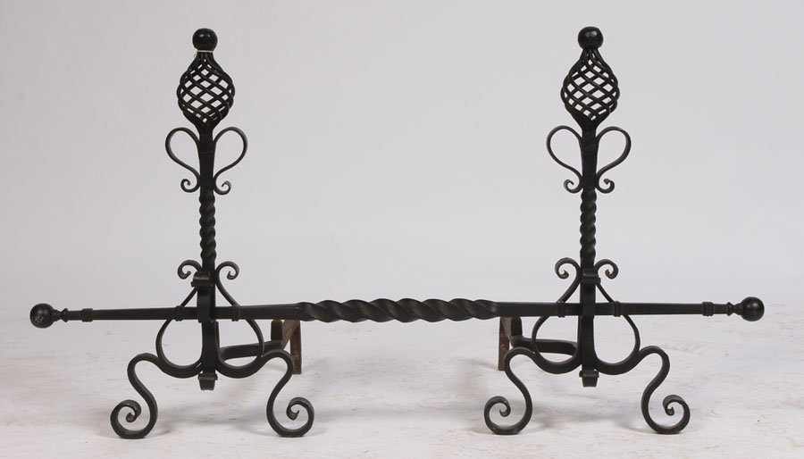 PAIR WROUGHT IRON ANDIRONS FIREPLACE: A pair of wrought iron andirons with twist finials and turned post having scroll decoration including cross post circa 1950. Ht: 26.5"
