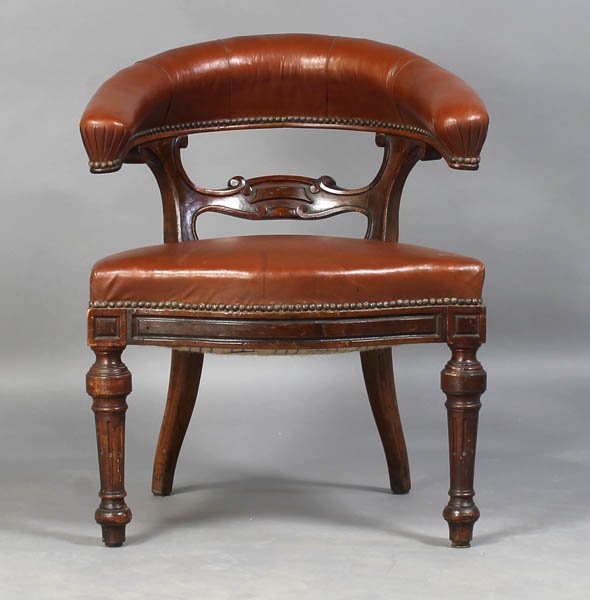 ANTIQUE ENGLISH EDWARDIAN LIBRARY CHAIR: English Edwardian library chair having an upholstered barrel back over carved splat and fitted seat circa 1870. On turned and stop fluted legs. Ht: 30" Width: 23" Depth: 20"