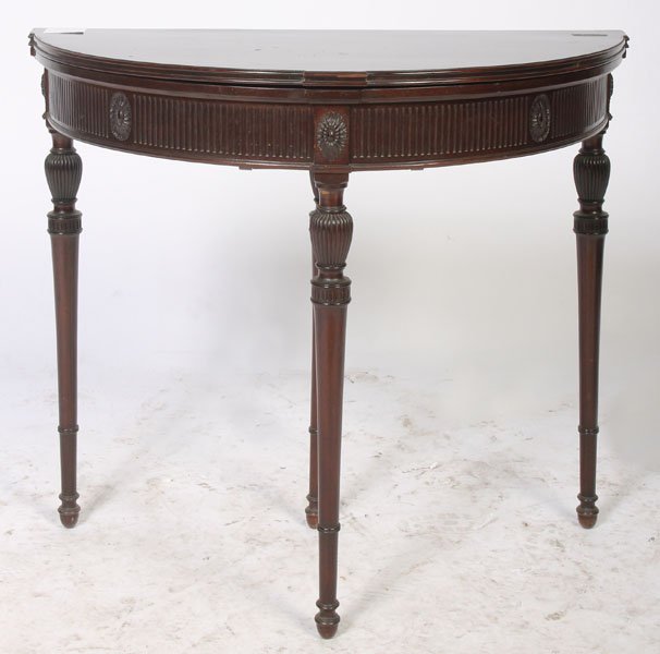 FEDERAL MAHOGANY FLIP TOP GAMES TABLE C. 1930: Federal style cabinet made mahogany flip top games table circa 1930. The demilune top opens to a felt lined surface. Ht: 30" Width: 34" Depth: 17"