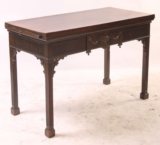 19TH C. GEORGIAN STYLE CARVED PIER TABLE: A 19th century Georgian style mahogany fret and urn carved pier table with pull-out slides. Ht: 32" Width: 46" Depth: 22"