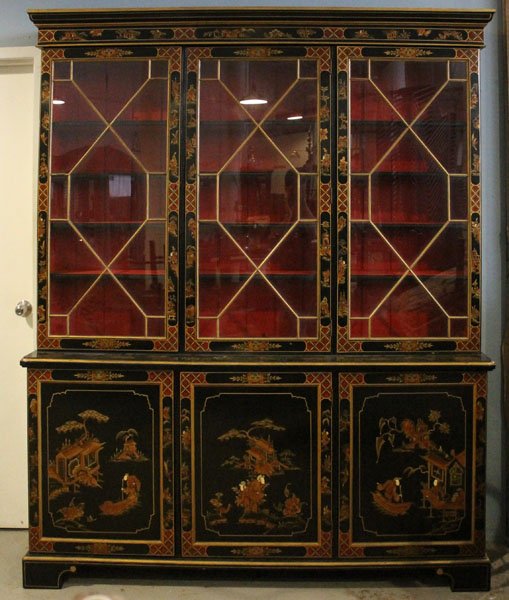 GEO III STYLE CHINOSERIE DECORATED BOOKCASE: A George III style chinoserie decorated bookcase having a stepped cornice over three gilt mullioned doors circa 1940. Having a lower cabinet with three paneled doors, raised on bracket base. Ht: 89" W
