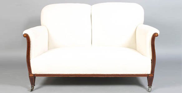 A MAHOGANY EDWARDIAN INLAID SETTEE CIRCA 1910: A mahogany Edwardian settee having line and fan inlay circa 1910. Recently recovered. Ensuite with the following lot. Settee: 33"H. x 51"W. x 30"D.