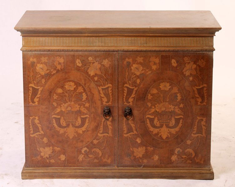 CONTINENTAL CERUSED INLAID CABINET: A Continental cerused and marquetry inlaid cabinet having stepped cornice over fluted frieze and two doors with floral and urn inlaid decoration. Circa 1920. Ht: 34" Width: 42.5" Depth: 17.5"