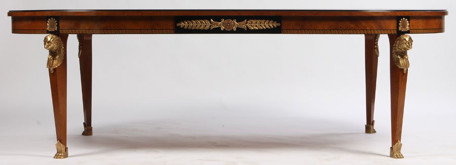 BRONZE MOUNTED FRENCH DINING TABLE: Empire style dining table having ebonized banding over Greek Key decorated apron supported on stylized bronze lion mounted tapered legs. With paw feet. Ht: 30.5" Width: 96" Depth: 51"