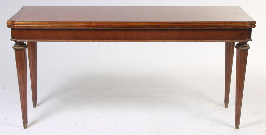 LOUIS XVI FLIP TOP CONSOLE TABLE DINING: Louis XVI style flip top console table that expands to a dining table circa 1940. The top having an inlaid sunburst design and rotating on its bronze mounted base to become a dining table. Opening: 63