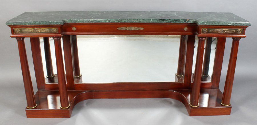 EMPIRE STYLE MIRROR MARBLE BRONZE CONSOLE TABLE: An Empire style console table having a shaped marble top over a molded apron with bronze rondels circa 1940. Supported on four columns and having a mirrored back. Ht: 35.5" Width: 76.5" Depth: 16"