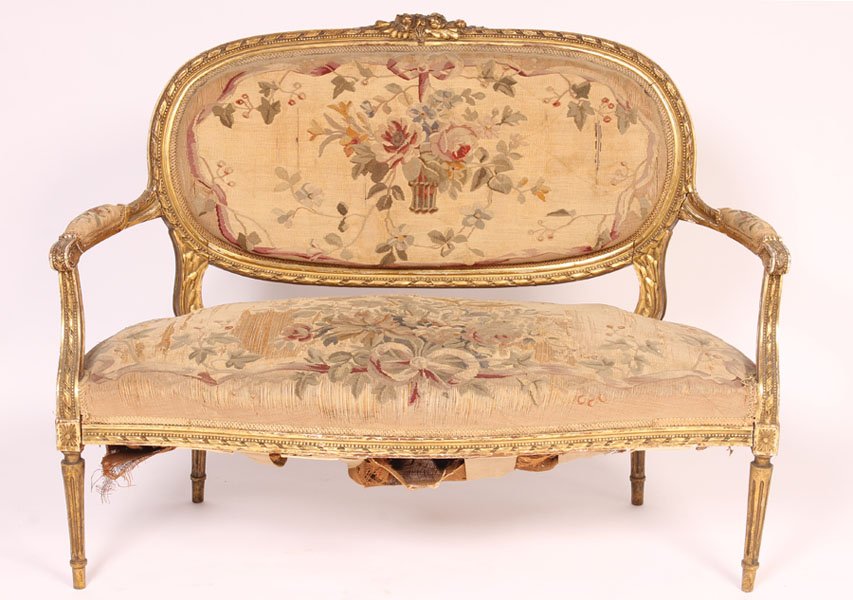LOUIS XVI GILTWOOD NEEDLEPOINT OPEN ARM SETTEE: Louis XVI style giltwood needlepoint open arm settee circa 1900. Ht: 38" Width: 50.5" Depth: 24"