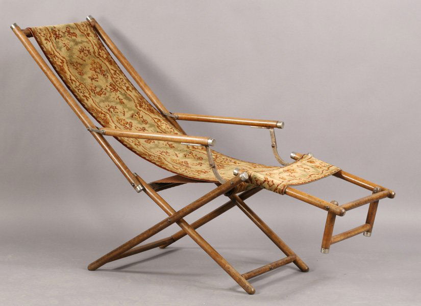 ANTIQUE RECLINING CHAISE LABELED C. 1890: Intriguing antique reclining chaise with woven rug sling seat labeled "Brilliant DRGM" circa 1890. Ht: 48" Width: 29" Depth: 32"