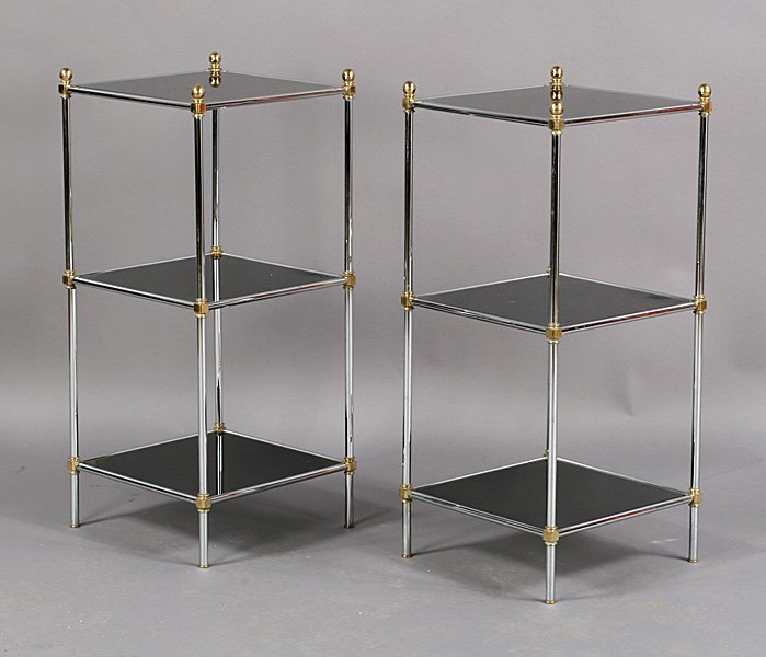 PAIR CHROME AND GLASS TABLES CIRCA 1970: Pair of mid century modern chrome and black glass tables circa 1970. Ht: 13.5" Width: 13.5" Depth: 31"