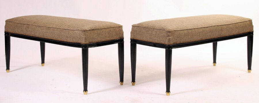 PAIR UPHOLSTERED EBONIZED BENCHES ANDRE ARBUS: Pair of upholstered and ebonized benches in the manner of Andre Arbus, the rounded tapered legs capped with bronze sabots. Ht: 20" Width: 47" Depth: 19.5"