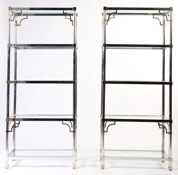 PAIR CHROME BRASS ETEGERES GLASS SHELVES: A pair of chrome and brass etegeres with corner decoration and glass shelves circa 1970. Ht: 72" Width: 31" Depth: 15"