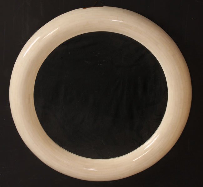 LARGE TASSELATED ACRYLIC CIRCULAR MIRROR: A large tasselated acrylic circular mirror. Ht: 42"