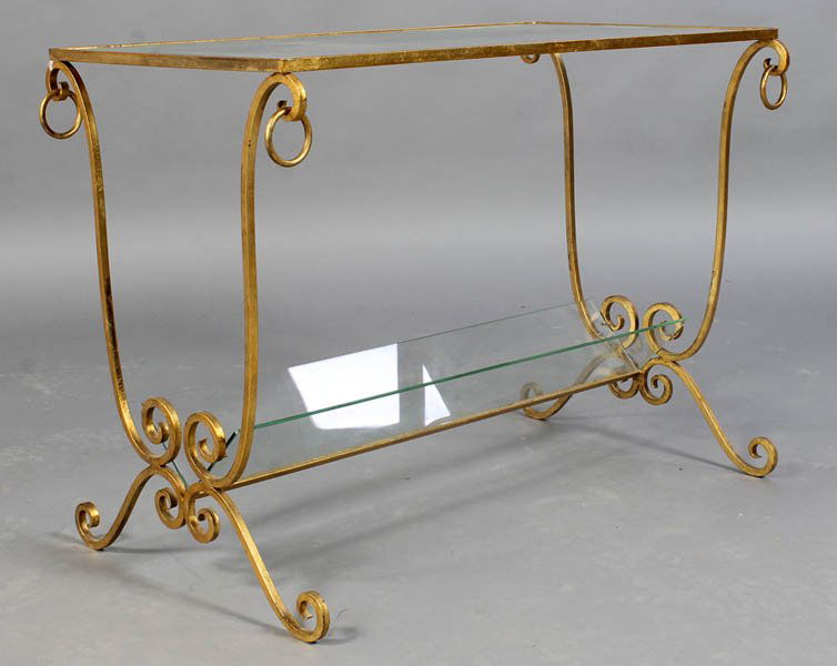 RAYMOND SUBES STYLE GILT IRON SIDE TABLE: Raymond Subes style gilt wrought iron side table having an inset glass top over downswept legs with ring decoration circa 1950. Ht: 24" Width: 31.5" Depth: 18.5"