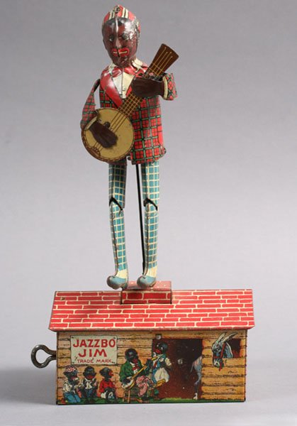 JAZZBO JIM DANCER ON ROOF VINTAGE WIND UP TOY: Fabulous Jazzbo Jim The Dancer on the Roof wind-up toy by Unique Art MFG Co. Newark circa 1920. Lot includes remains of original box. Ht: 10" Width: 5" Depth: 3.25"