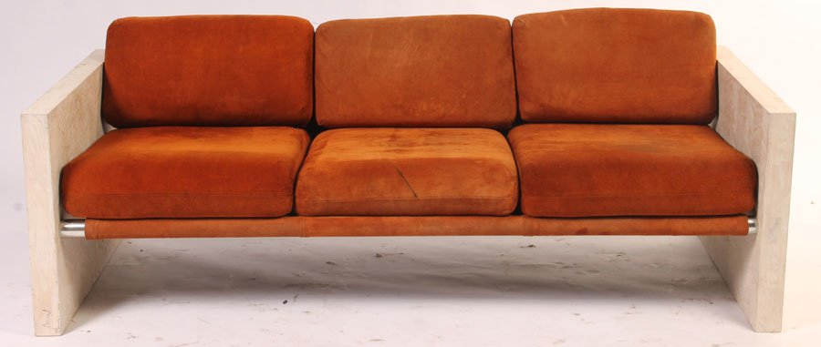 A MID CENTURY MODERN OAK SOFA CIRCA 1970: A mid century modern cerused oak sofa having loose suede cushions and chevron oak sides circa 1970. Ensuite with the previous lot.