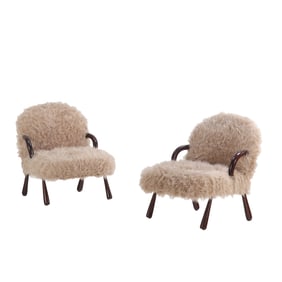 PAIR OF FAUX SHEEP SKIN LOUNGE CHAIRS WITH HIP RESTS IN THE MANNER OF JEAN ROYERE.