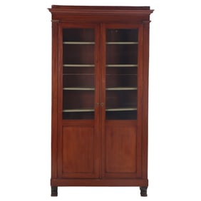 FRENCH EMPIRE MAHOGANY TWO DOOR CABINET HAVING CLAW FEET AND ADJUSTABLE SHELVING C 1860.