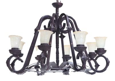 LARGE EIGHT ARM IRON CHANDELIER WITH GLASS SHADES.