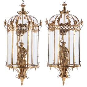 LARGE PAIR OF BRONZE LANTERNS HAVING CURVED GLASS AND LARGE FEMALE FIGURES HOLDING A FOUR ARM